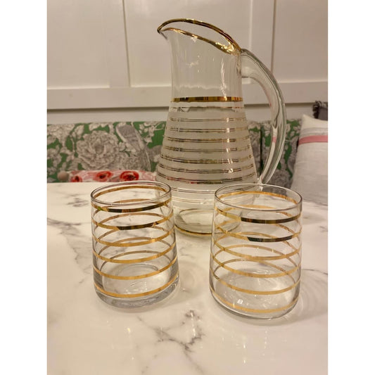 Vintage mid-century modern clear glass pitcher with gold stripes and 2 matching glasses