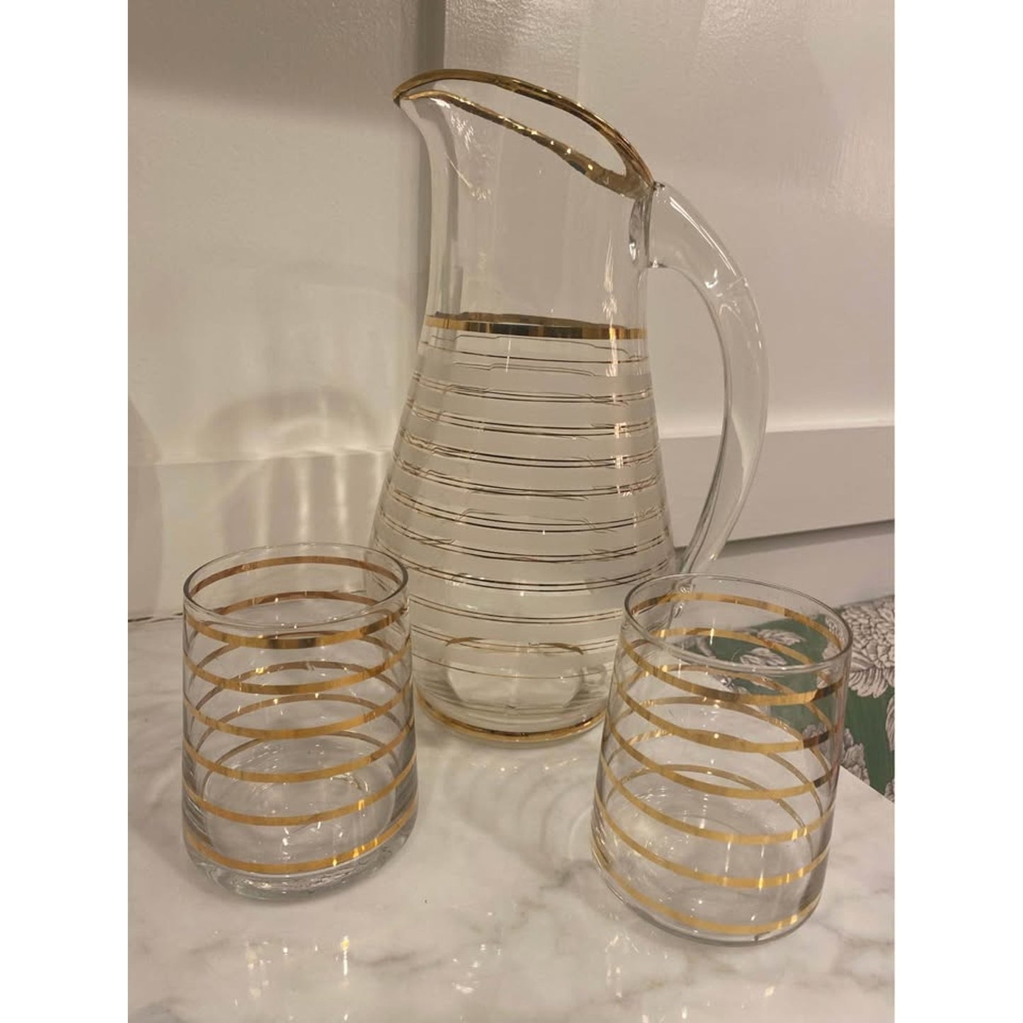 Vintage mid-century modern clear glass pitcher with gold stripes and 2 matching glasses